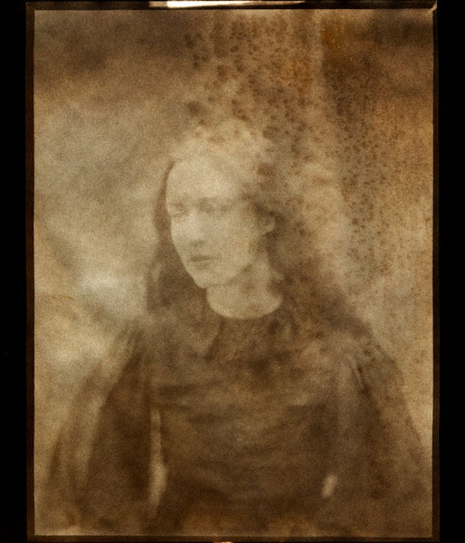 Sepia-tone print of a portrait of a woman.