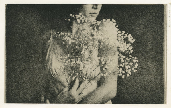 A print of a woman holding flowers.