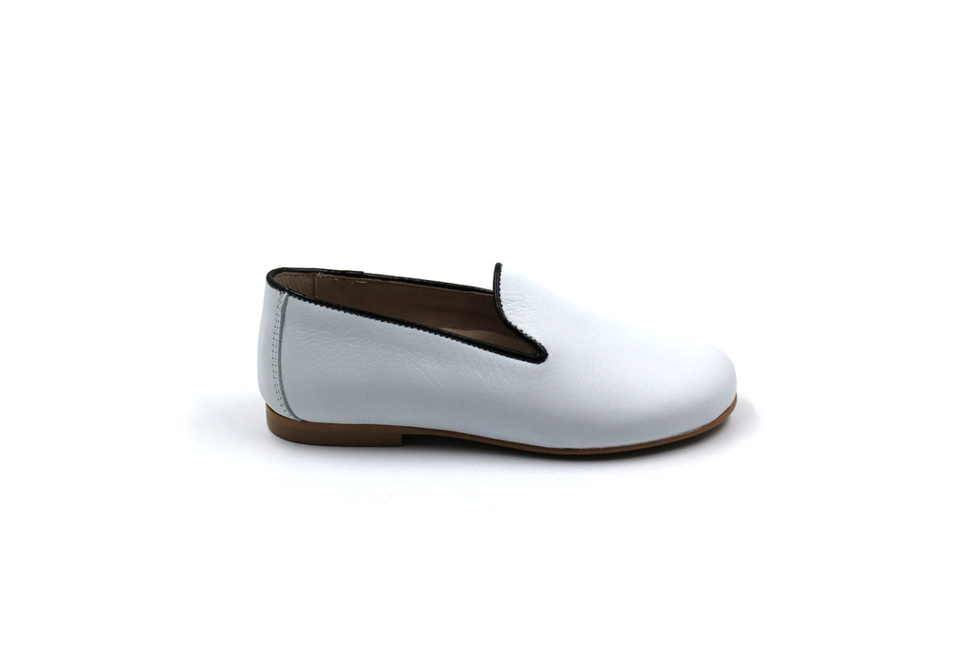 white and black dress shoes