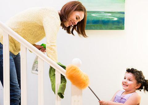 The mom is cleaning the house with a daughter using AspenClean natural products