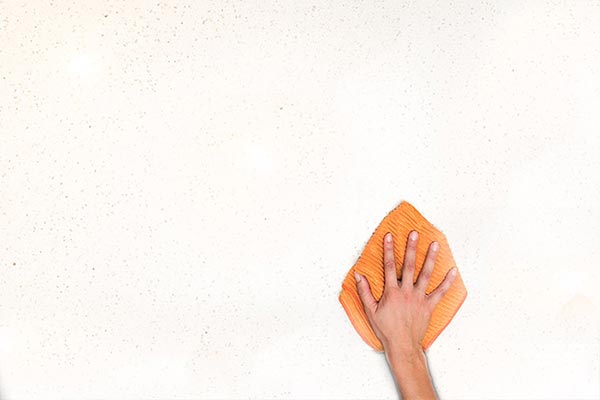 cleaning the wall with AspenClean microfiber cloths