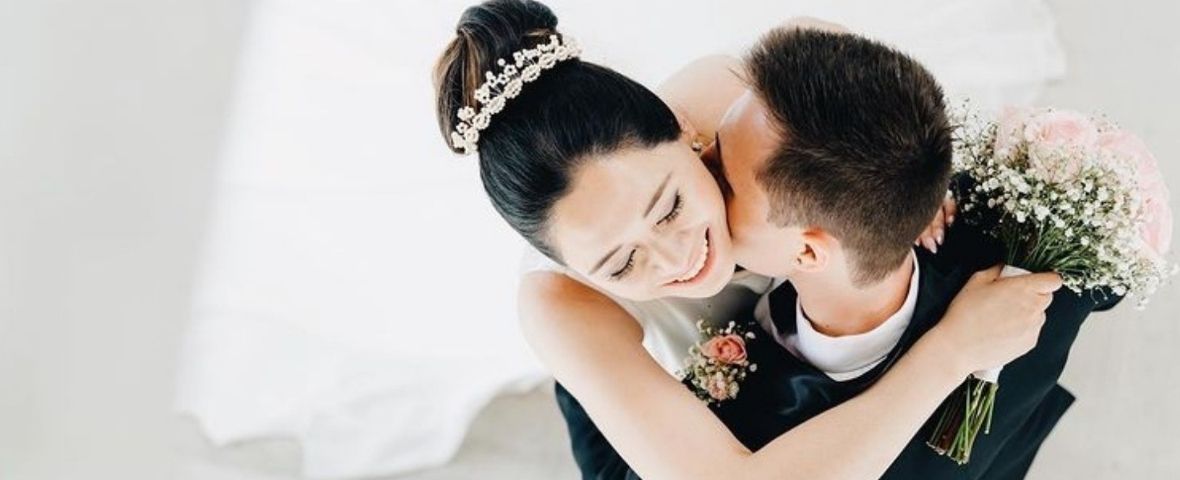 Bride with beautiful bun and jewelled hair piece by The Story of Love