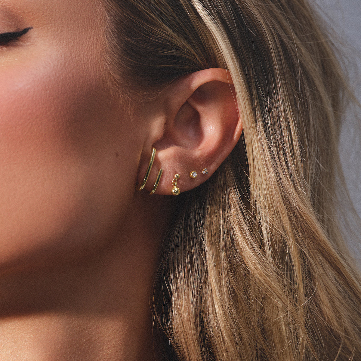 Seeing Double Spiral Hoop Earrings in Gold   Uncommon James