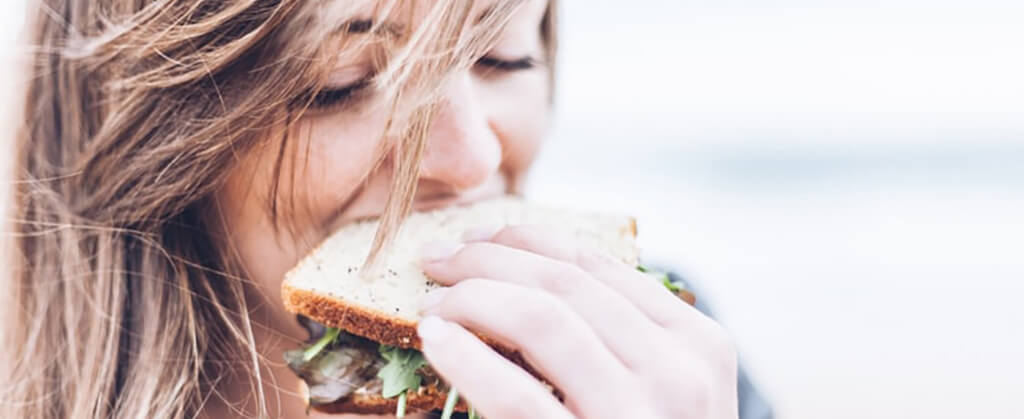 woman eating sandwich