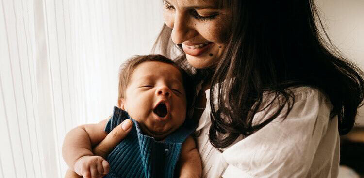 woman smile with baby