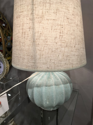 light blue ceramic lamp with oatmeal shade