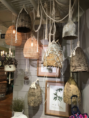 Display with hanging beehives and lights