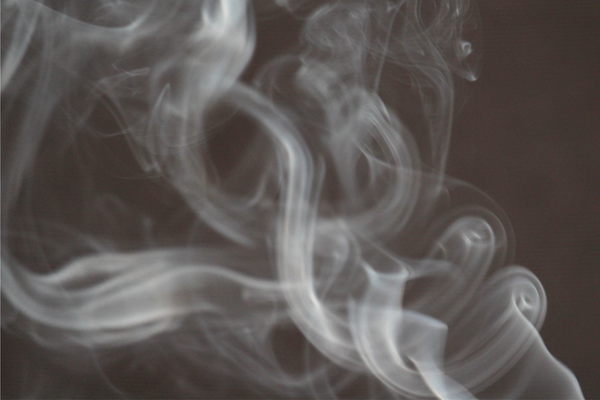 smoke wisps on black background