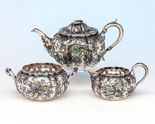 Japanese Work Sample tête-à-tête service number 8768, 1897–1898. Silver and enamel: teapot height 3 ¾ width 7 ½ inches; sugar bowl height 2 ⅜, width 5 ¾ inches; milk pot height 2 ¾, width 5 inches. Philadelphia Museum of Art, purchased with funds contributed by Marguerite and Gerry Lenfest