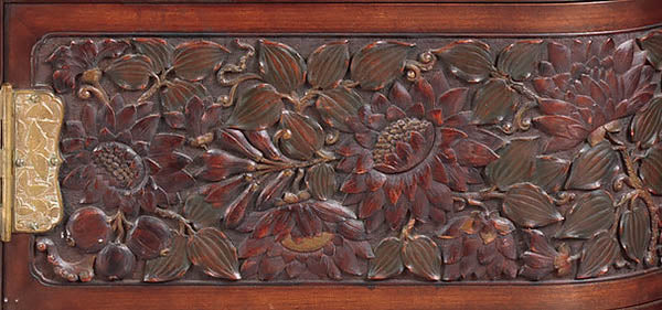 Carved pomegranate panel on the Herter Brothers cabinet for William H. Vanderbilt, 1879-82, courtesy of Metmuem.org