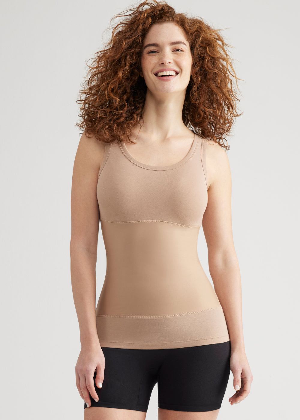 boyfriend yummie tummie® 3-panel shaping tank in Almond worn by a woman facing forward with arms at side Yummie