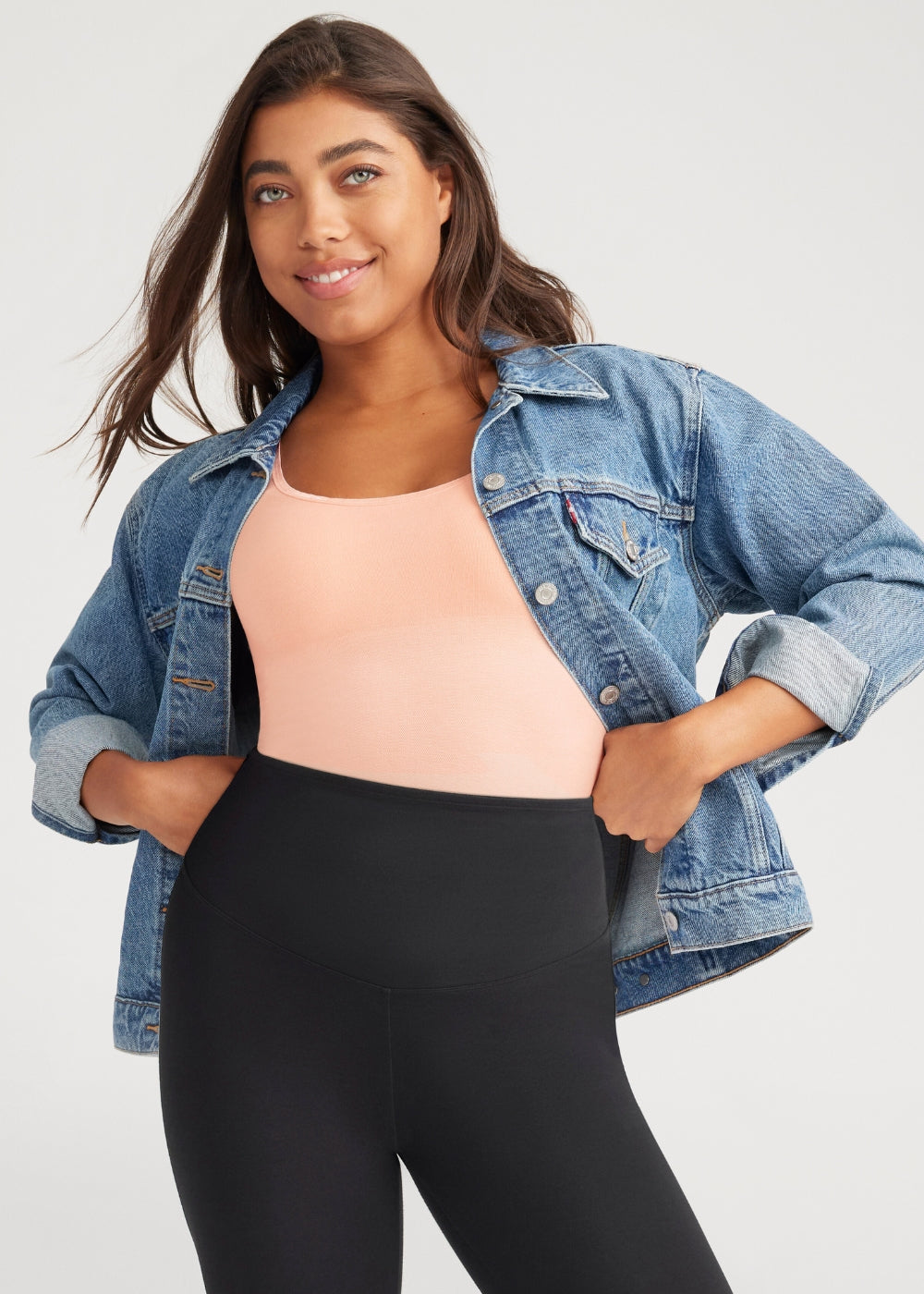 2-way shaping tank - outlast® seamless in english rose worn by a woman under a jean jacket with white pants, standing with her left hand on her hip