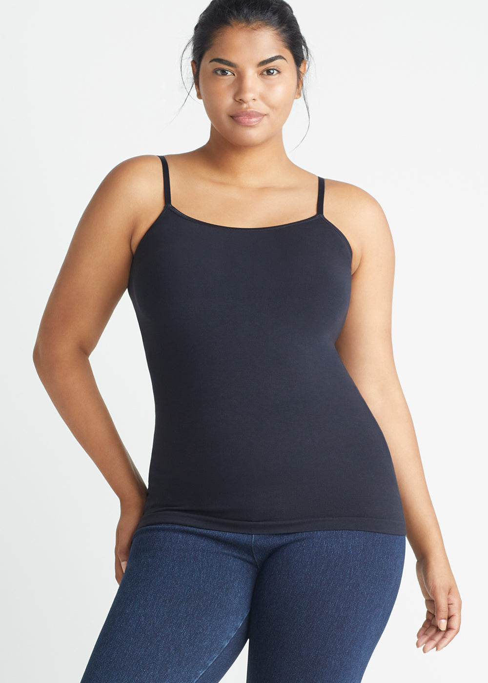 Convertible Shaping Camisole - Outlast® Seamless in Black worn by model with hand on hip facing forward Yummie