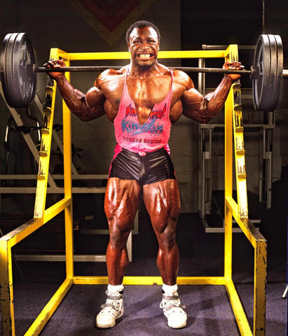 Bodybuilder on a squat rack wearing 80s bodybuilding clothes