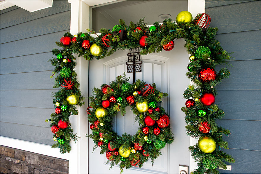 Village Lighting Festive Wreath and garland on front door.