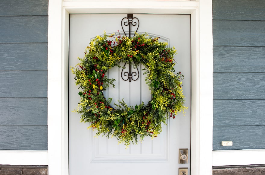 Boxwood & Berry Wreath Hanging On Front Door