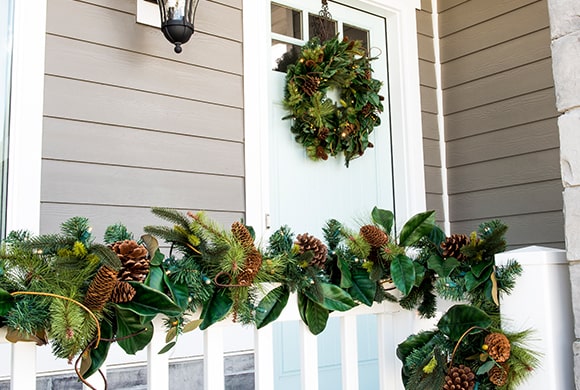 Magnolia Leaf Wreath and Garland Hanging on front pourch