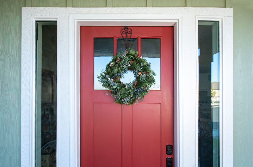 Rustic White Berry Wreath Hanging On Front Door