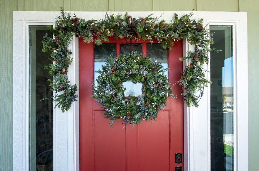 Rustic White Berry Wreath and Garland Hanging On Front Door