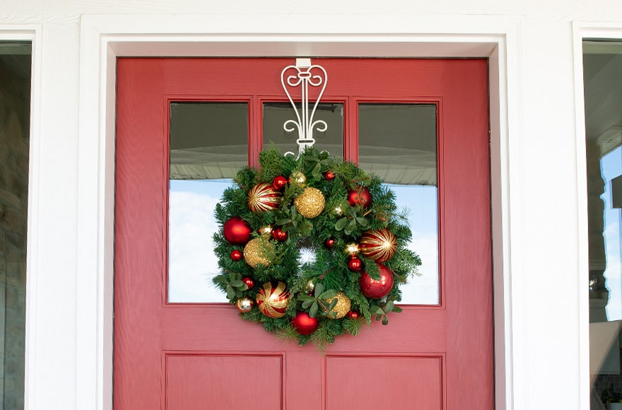 Christmas Classic Red and Gold Wreath Hanging On Front Door