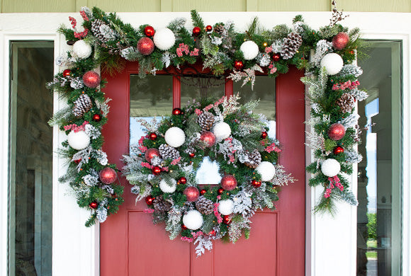 Frosted Wonderland Wreath and Garland Hanging On Front Door