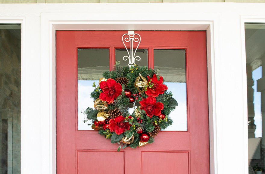 Red Magnolia Wreath Hanging On Front Door