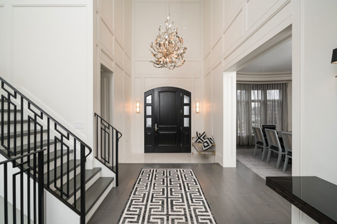 chandelier in stunning grey and neutral entrance hall