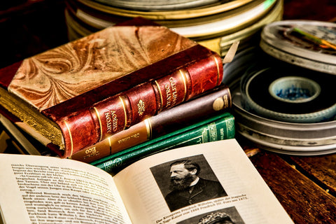 Antique books with vintage rolls of film -- Antiquarian Aesthetic 