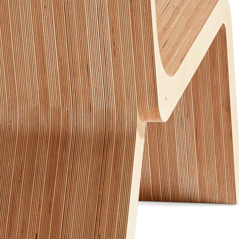 back face of a lounge chair illustrating multiple layers of natural wood. each layer has unique natural characteristics.