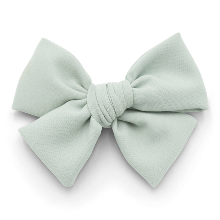 The Kindred Studio sage midi bow against white backdrop