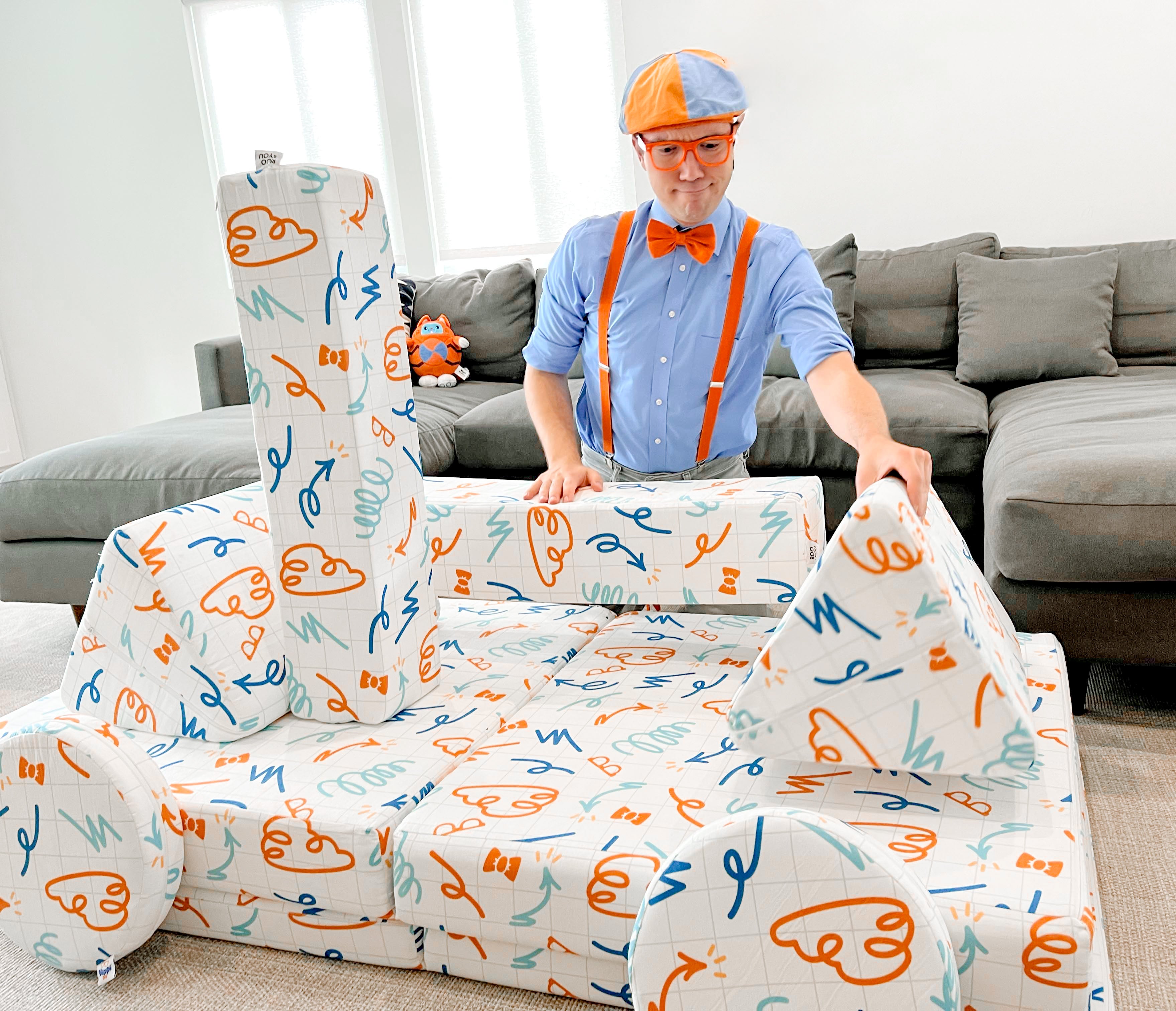 Blippi making a car with a play couch