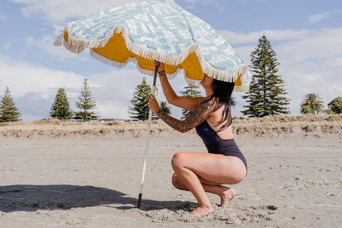 zero waste swimwear made in new zealand. Photography by Lou Lou B, Mount Maunganui, Model Shayna Ormsby, Vintage umberella