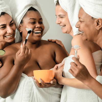 women applying skincare together