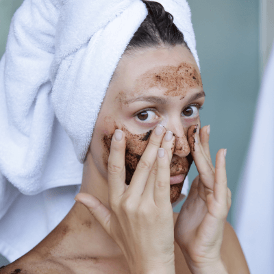 woman scrubbing face