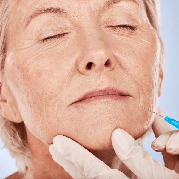 woman getting injection on chin