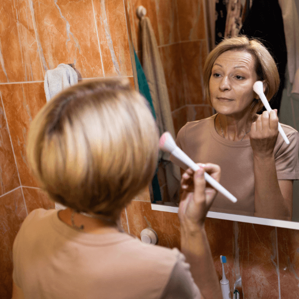 woman applying makeup