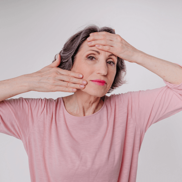 Woman doing facial exercises