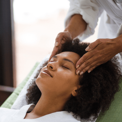 woman receiving temple massage