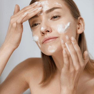 woman cleansing face