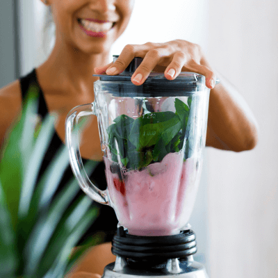 woman making a smoothie