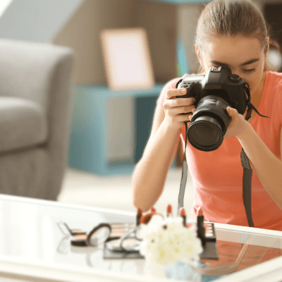 woman taking photos of cosmetics