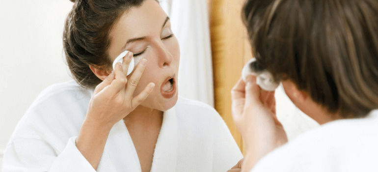 woman removing makeup