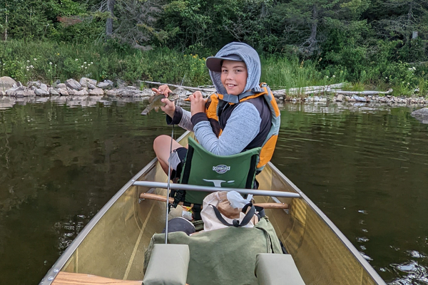 Kid Canoeing Fishing