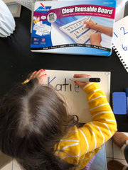 Child Using Writeboard Kit