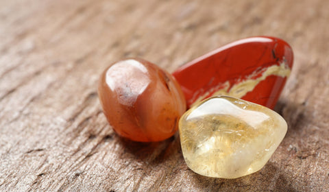 A visually appealing image showcasing a pair of Carnelian crystals placed on a rustic wooden surface. Carnelian crystals, known for their vibrant energy and metaphysical properties, bring vitality, motivation, and creativity into your space. These beautiful crystals on the wooden surface add a touch of natural beauty and positive energy to any setting. #CarnelianCrystals #WoodenSurface #VibrantEnergy #MetaphysicalProperties #Vitality #Motivation #Creativity #NaturalBeauty #PositiveEnergy