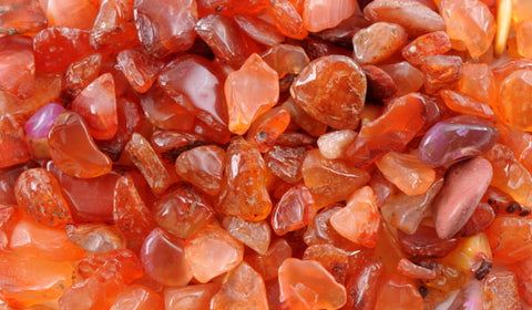 A variety of authentic carnelian raw crystals in different sizes and shapes. Carnelian is a powerful crystal that can promote energy, creativity, and motivation. #CarnelianRaw #CrystalHealing #Energy #Creativity #Motivation