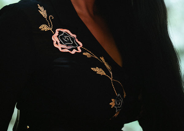 Detail image of a black vintage Sue Wong dress; ribbon floral embroidery