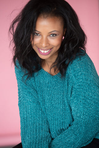 Headshot of Alexandria Boddie wearing a cerulean sweater