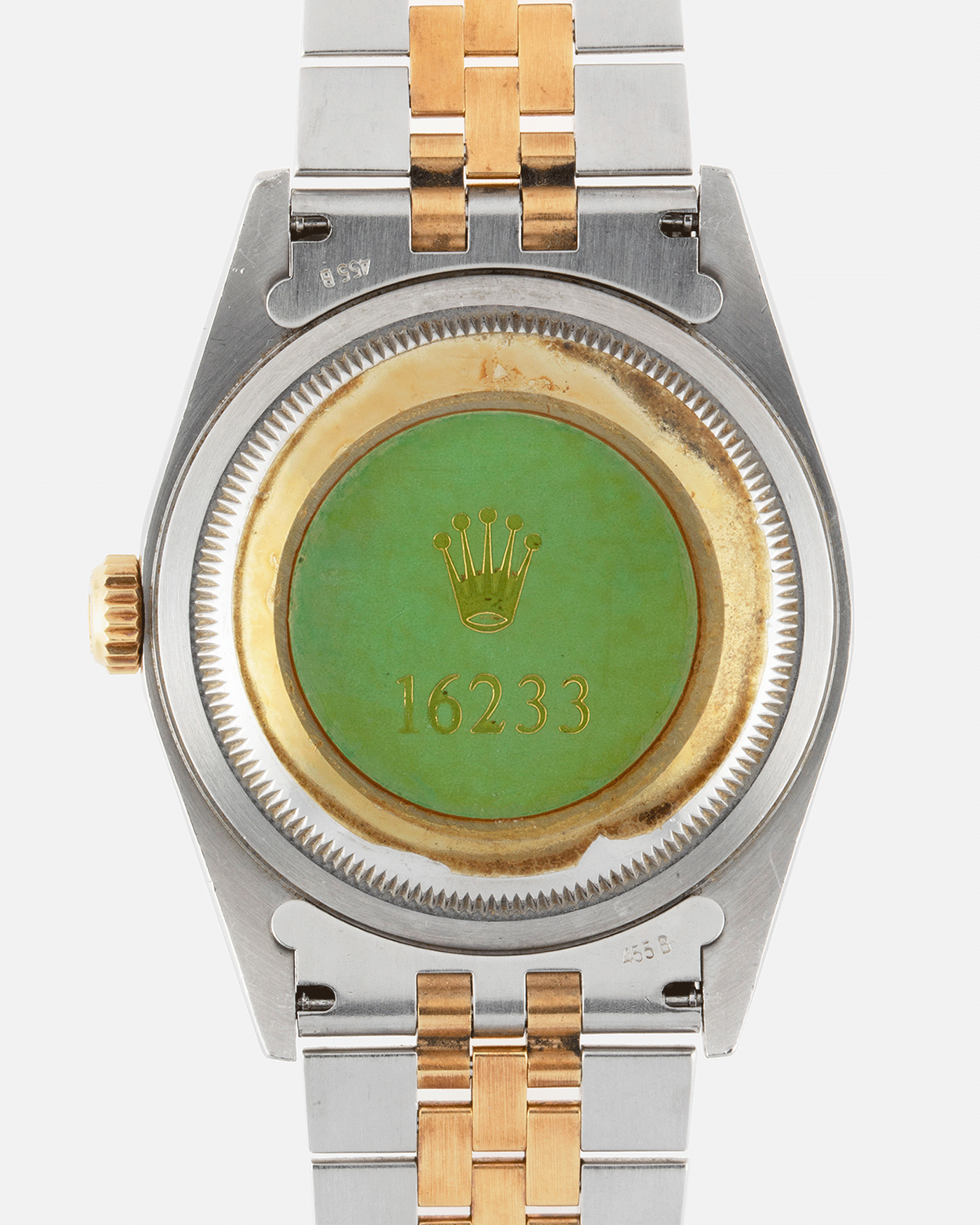 green sticker on back of rolex