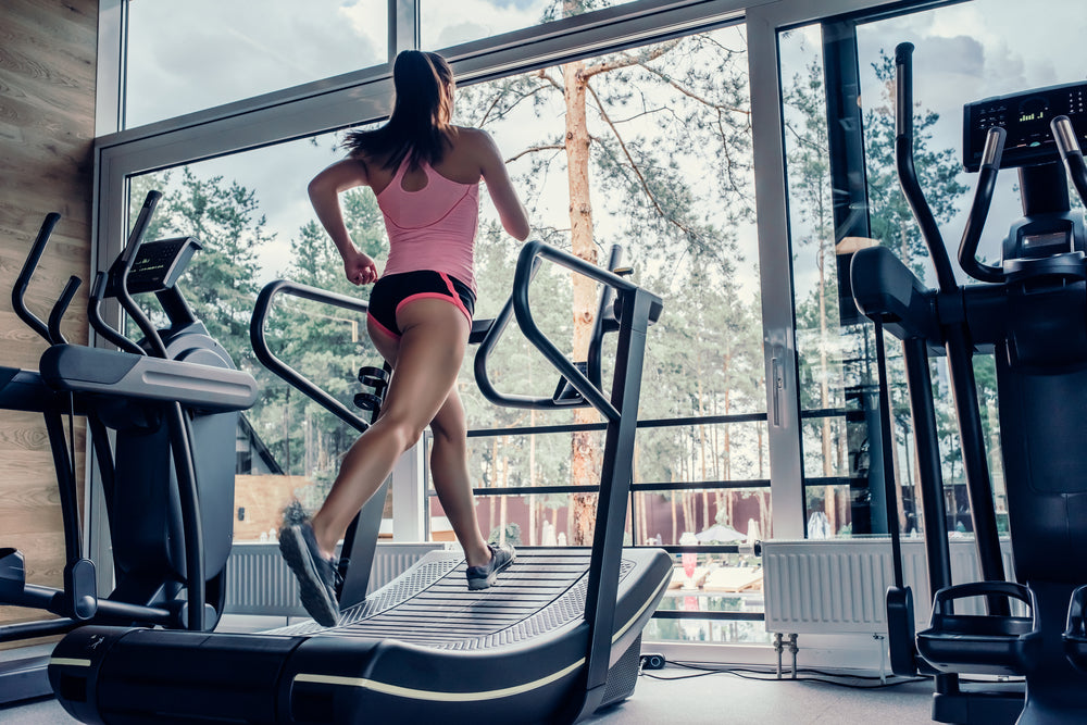 Girl on curved treadmill